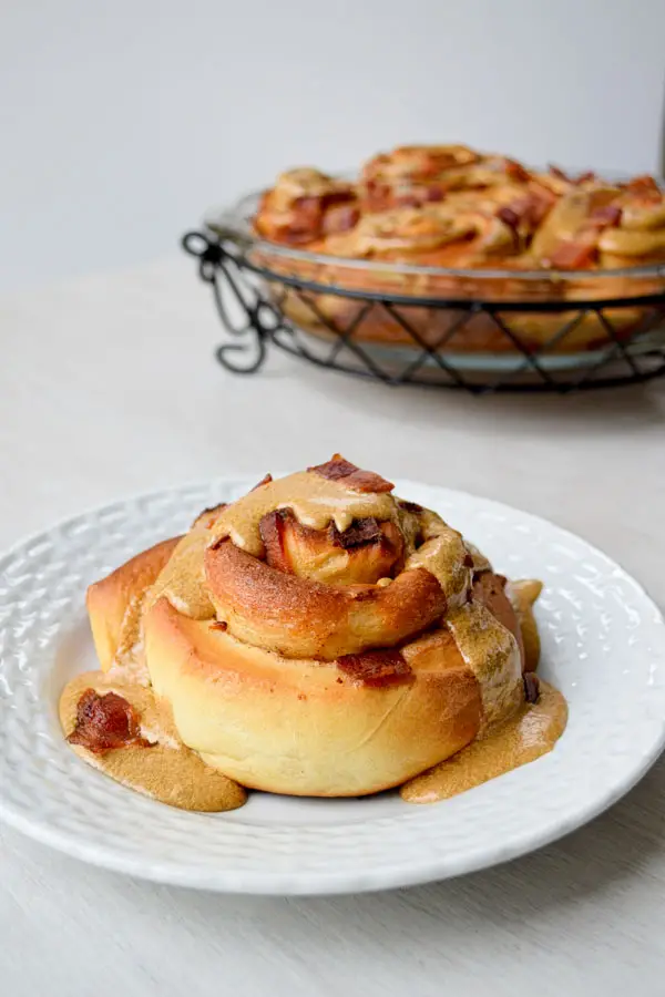 Maple bacon cinnamon rolls take the sweet and salty combo to new heights! Classic cinnamon rolls are stuffed with bacon and topped with a maple icing...plus more bacon!
