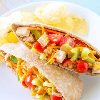 Chicken Veggie Pitas chock full of cheese, celery, carrots and tomatoes!