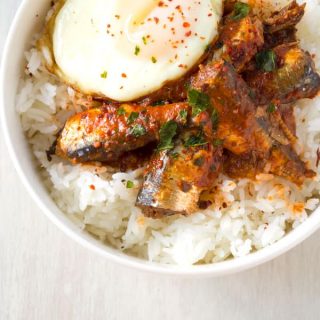 Healthy sardine rice bowl with canned sardines in tomato sauce. Skip the crackers and top with egg for an easy dinner!