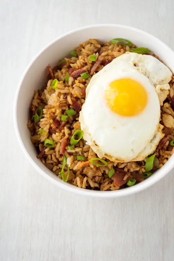 Bacon Fried Rice with a fried egg on top! Quick and easy breakfast, lunch or dinner!