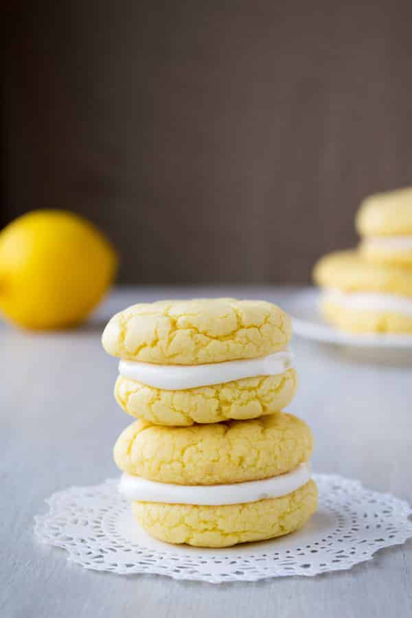 Velvety soft and chewy lemon sandwich cookies with tangy cream cheese frosting! They start with a cake mix and can be ready in 30 minutes!