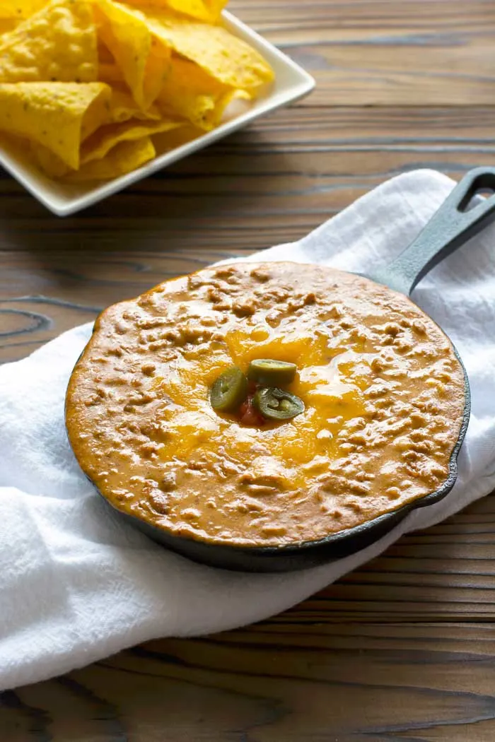 Easy, creamy meatless Chili Cheese Bean Dip with all natural ingredients - no processed junk food here! Perfect for gameday! #cleaneating #realfood #appetizer | Kitchen Gidget