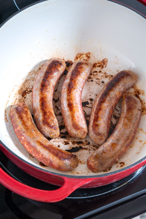 Pot of sizzling Italian sausages