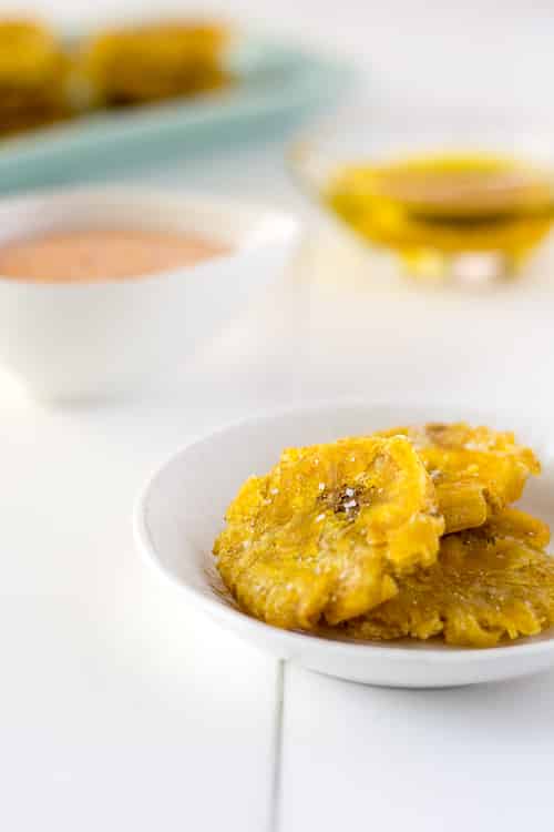 Puerto Rican Tostones (Fried Plantains) with 2 dippings sauces: MayoKetchup & Mojo de Ajo (Garlic Oil) | Kitchen Gidget