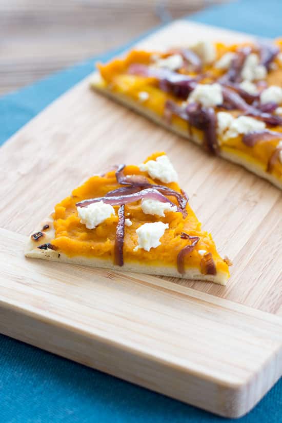 Winter Squash Feta Flatbread recipe with caramelized red onions and feta cheese. Great with butternut, kabocha, acorn squash or even sweet potatoes!