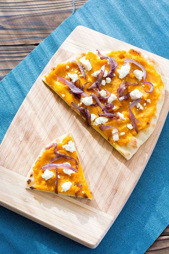 Winter Squash Feta Flatbread recipe with caramelized red onions and feta cheese. Great with butternut, kabocha, acorn squash or even sweet potatoes!
