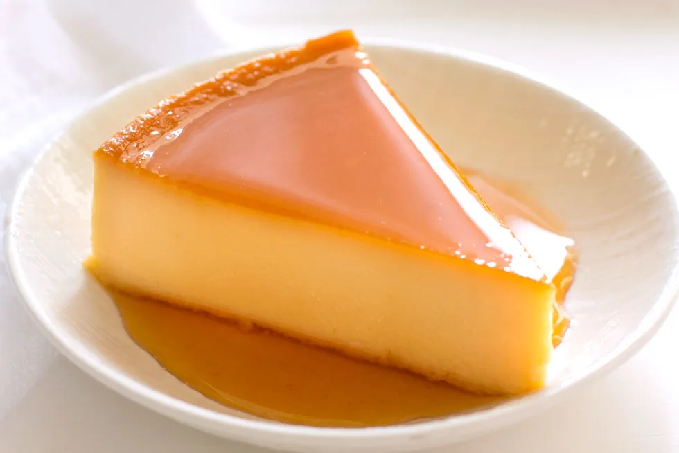 Slice of cheese flan on a small plate