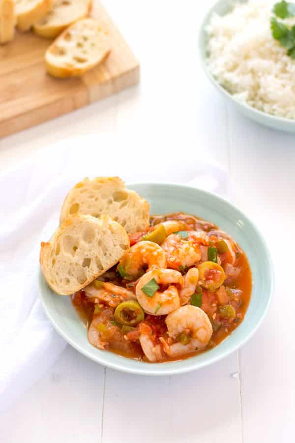Camarones Guisados - juicy shrimp stewed in a Puerto Rican-style tomato sauce. Loaded with garlic, onions and cilantro, no sofrito needed! | Kitchen Gidget