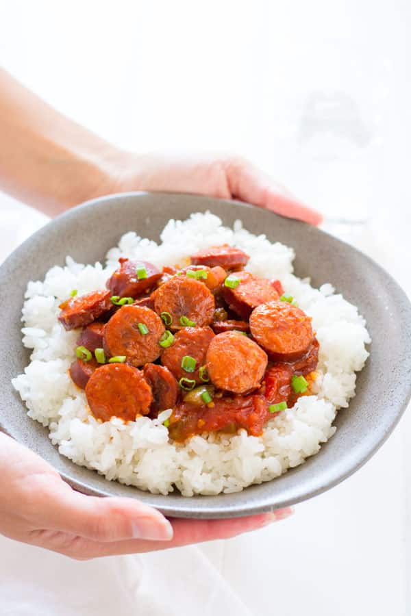 Smoked sausage creole is a riff on classic shrimp creole simmered in a simple sauce of tomatoes, peppers and onion. Serve with rice for an easy dinner! | Kitchen Gidget