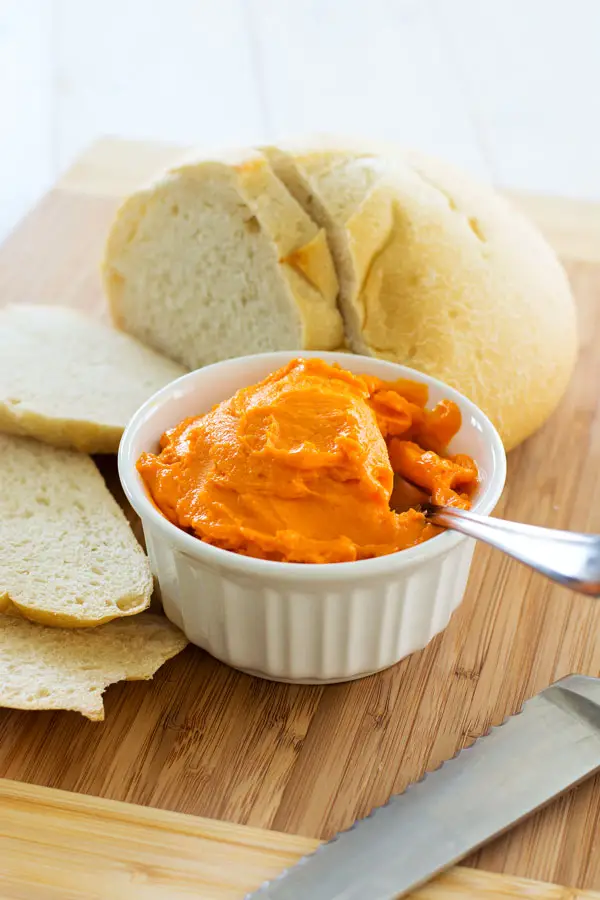 Cheddar cheese spread recipe for the best cheesy bread you've ever had! Spread on sourdough and broil until bubbly!