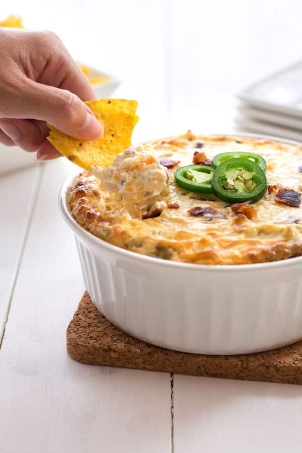 Jalapeño cream cheese dip loaded with green chiles, cheddar cheese and bacon! It doesn’t get any better than this addicting dip!