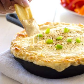 Cajun Chicken Alfredo Dip with cream cheese, mozzarella, chicken and spice. Only five ingredients in this super cheesy dip with a creole kick!