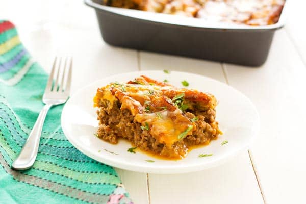 Puerto Rican Lasagna (Pastelón) with sweet slices of plantains instead of noodles, saucy beef picadillo and plenty of cheese.