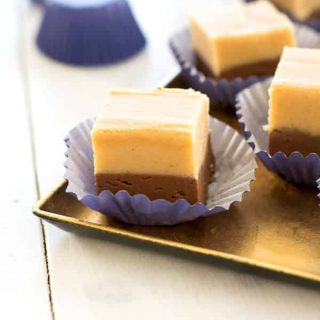 Easy chocolate peanut butter fudge is a nostalgic treat! Creamy confection with two layers of chocolate and peanut butter!
