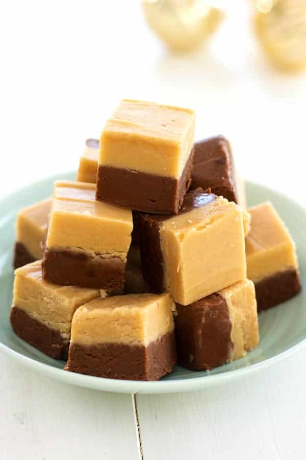 Easy chocolate peanut butter fudge is a nostalgic treat! Creamy confection with two layers of chocolate and peanut butter!