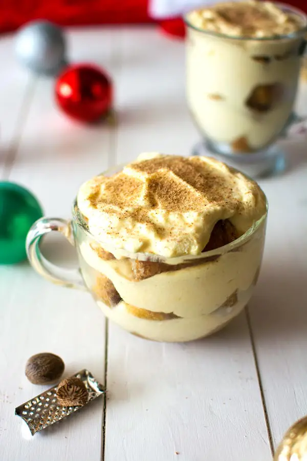 Try this Eggnog Tiramisu for the holidays! Authentic Italian tiramisu with the flavor of creamy holiday eggnog, nutmeg and espresso dipped ladyfinger cookies!