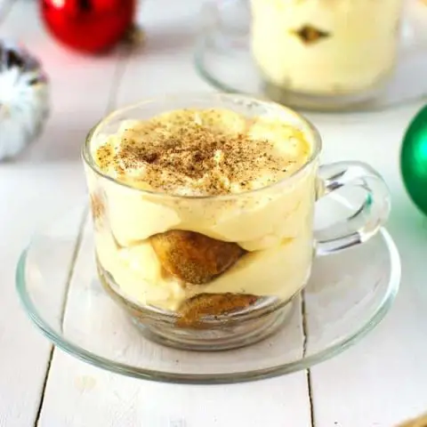 Try this Eggnog Tiramisu for the holidays! Authentic Italian tiramisu with the flavor of creamy holiday eggnog, nutmeg and espresso dipped ladyfinger cookies!