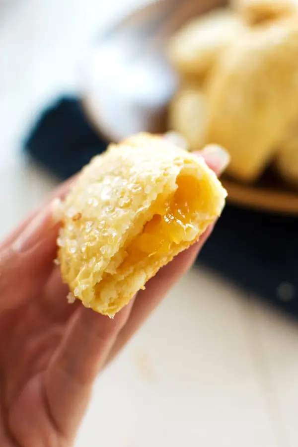 These tasty little pineapple empanadas are a breeze to make with only three ingredients in the crust and pineapple preserves for the filling! Easy breakfast or dessert!