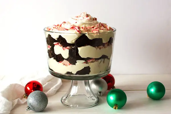 Chocolate Peppermint Trifle with layers of fudgy chocolate brownies, cheesecake pudding and cool peppermint combine in this festive dessert!