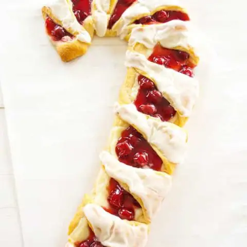 Christmas Breakfast Danish: cherry cheese pastry in candy cane shape! Easy to make with crescent rolls, cherry pie filling and cream cheese.