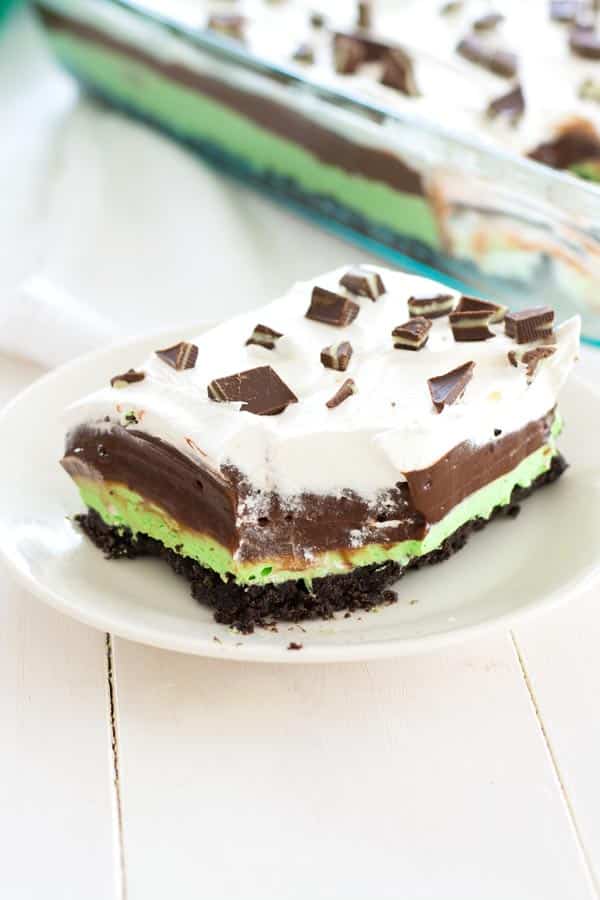 Mint Chocolate Lasagna no-bake dessert with layers of mint cream cheese and chocolate pudding on an Oreo crust. This cool, minty Oreo Delight is the perfect ending to any meal!