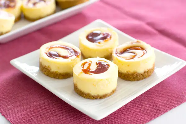 These tropical mini guava cheesecakes taste as good as they look! Perfect dessert recipe for a Puerto Rican or Cuban dinner!