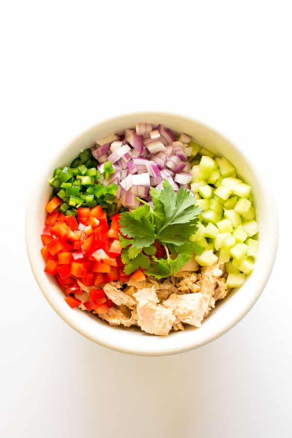This Mexican tuna salad is a fiesta for your taste buds! Kick your tuna up a notch with this fresh and easy version that goes well with avocado!