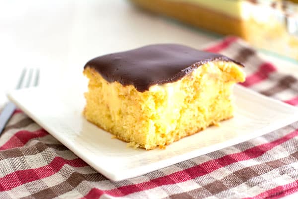 Easy Boston Cream Poke Cake recipe with delish chocolate ganache! Popular at potlucks!