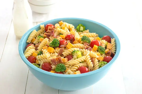 Bacon Cheddar Ranch Pasta Salad is a hit at potlucks! Or add chicken for an easy dinner with veggies!