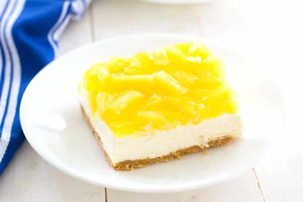 Easy No-Bake Pineapple Cheesecake Bars recipe - everyone will love these tropical dessert bars!
