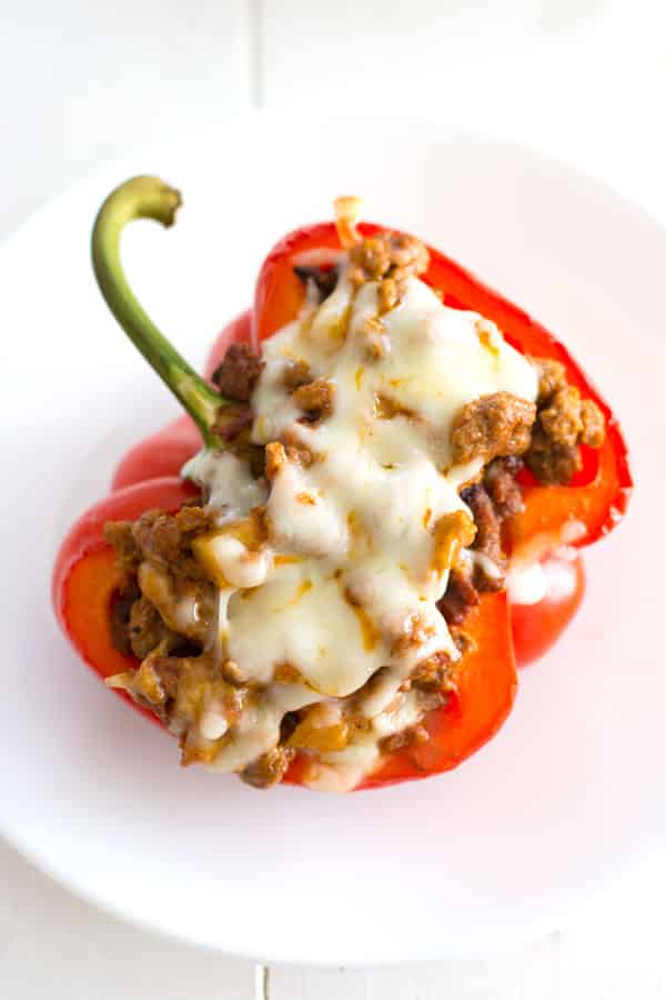 Ground beef picadillo stuffed peppers - a quick and delicious dinner recipe with a Puerto Rican twist!