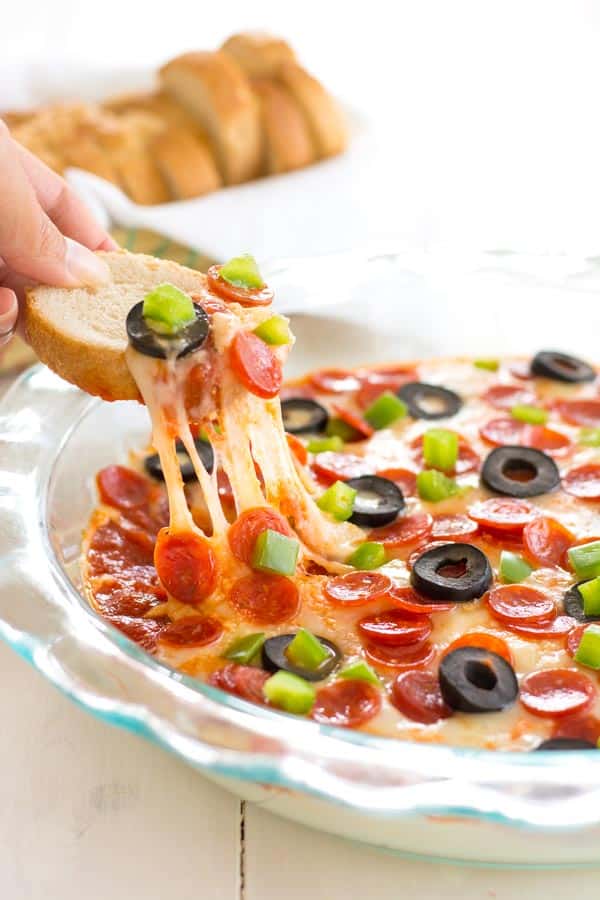 Easy pizza dip recipe with cream cheese and pepperoni. A Super Bowl appetizer favorite!