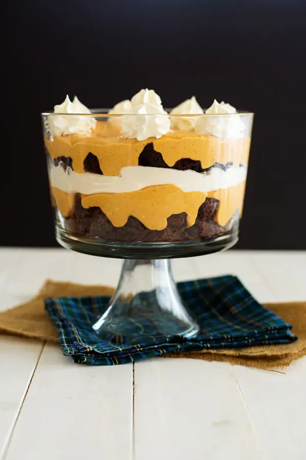 Layers of fudgy chocolate brownies, pumpkin cheesecake pudding and warm pumpkin spice combine in this festive dessert. Pumpkin brownie trifle is an easy yet stunning dessert to make this holiday season!