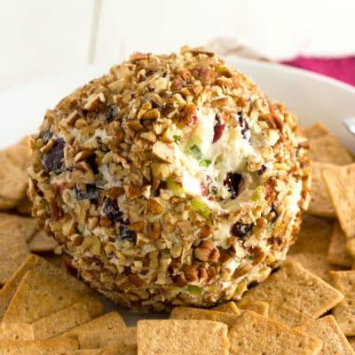 Blue Cheese Cranberry Cheese Ball recipe for parties or the Super Bowl! Bursting with flavors and textures like crunchy pecans, celery, sweet peppers and green onions! #appetizer