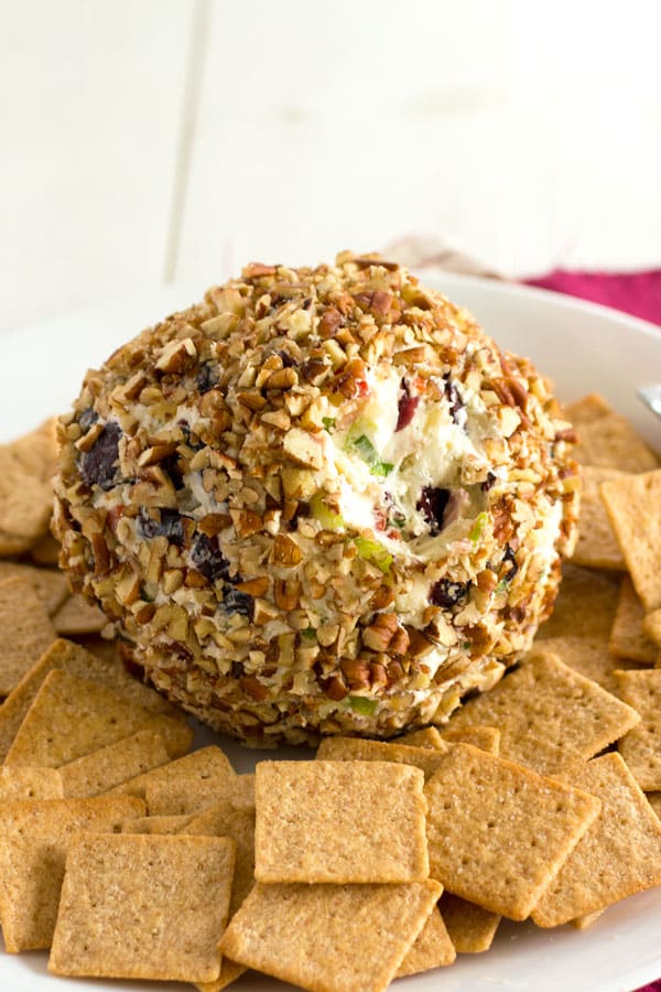 Blue Cheese Cranberry Cheese Ball recipe for parties or the Super Bowl! Bursting with flavors and textures like crunchy pecans, celery, sweet peppers and green onions! #appetizer