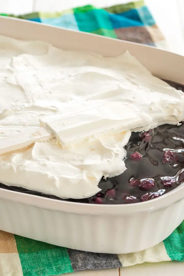 Blueberry Delight with graham cracker crust - cheesecake meets blueberry fluff in this no bake dessert!