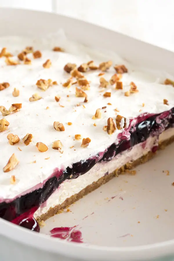 Blueberry Delight with graham cracker crust - cheesecake meets blueberry fluff in this no bake dessert!