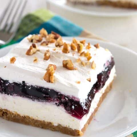 Blueberry Delight with graham cracker crust - cheesecake meets blueberry fluff in this no bake dessert!