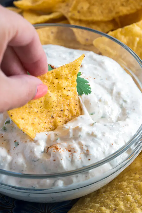 Creamy sour cream, fresh cilantro, crumbled queso fresco and a few Mexican spices are all you need to make this easy queso fresco dip!