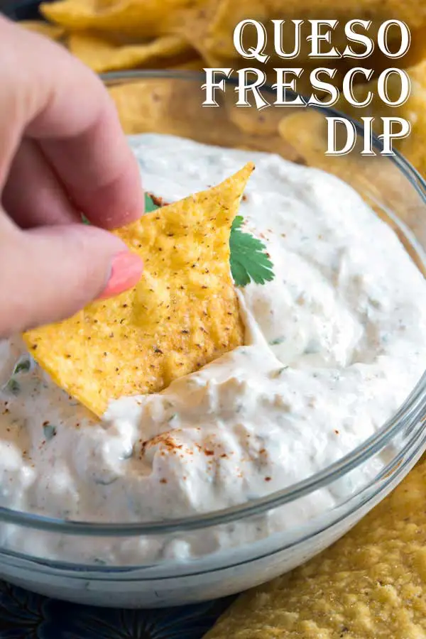 This queso fresco dip with sour cream takes just minutes to prepare, but packs big flavor! Creamy sour cream, fresh cilantro, crumbled queso fresco and a few Mexican spices are all you need to make this easy queso fresco dip! #mexican #appetizer #cheese 