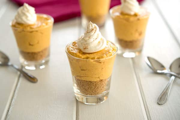 No bake pumpkin cheesecake served in mini jars for a cute and easy dessert for Fall or Thanksgiving!