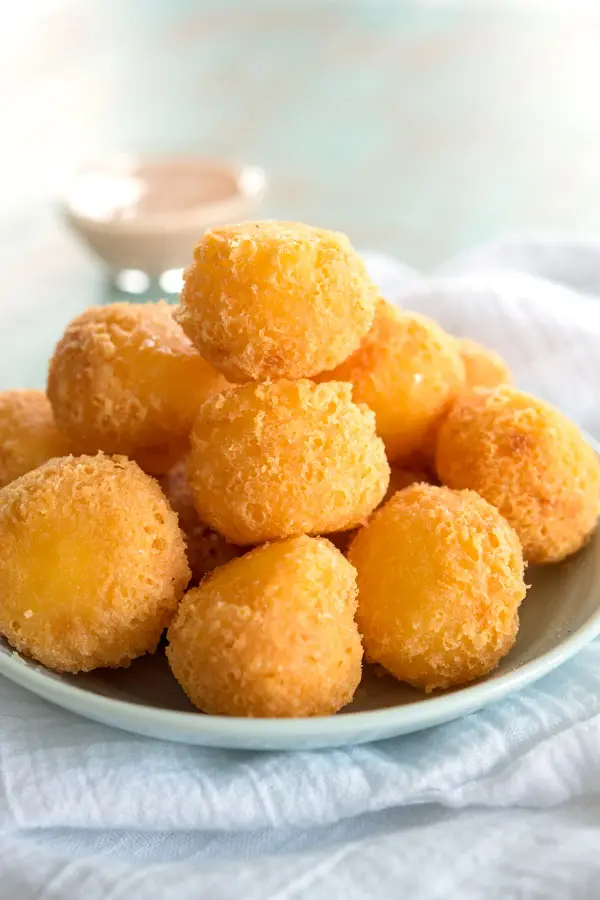 Plate of bolitas de queso (fried cheese balls) - an easy 3 ingredient appetizer!