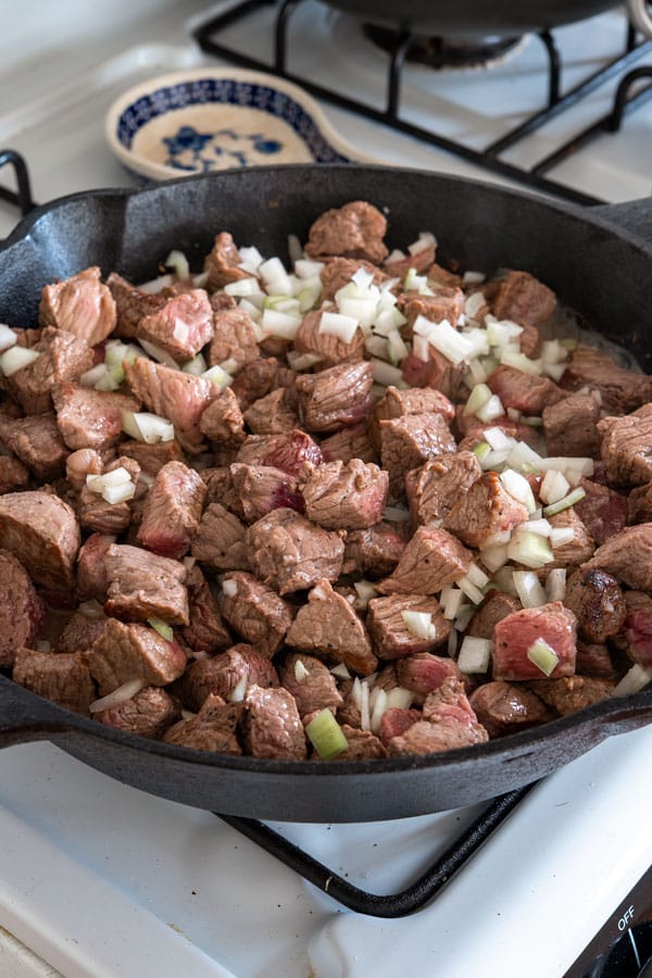 Carne guisada recipe with onions and gravy