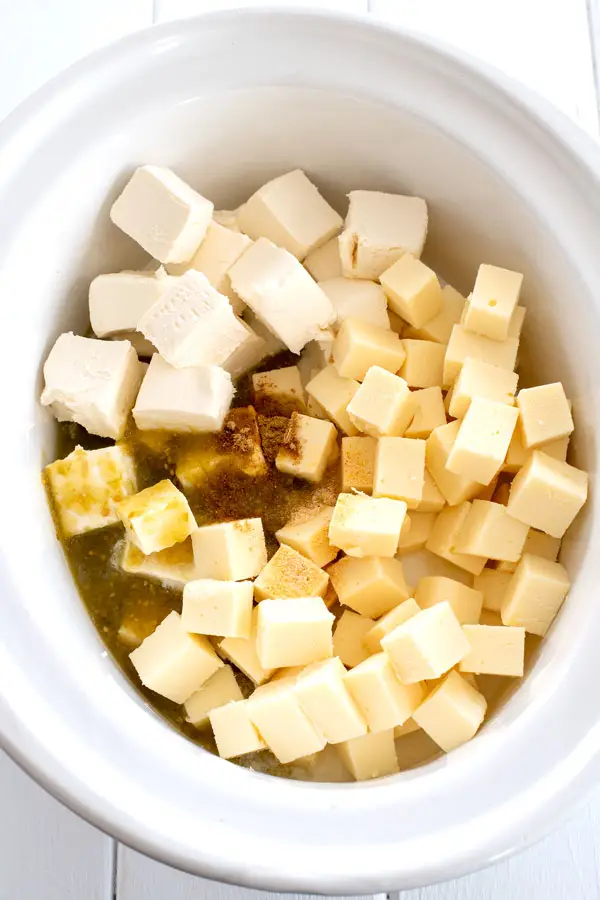Ingredients for crock pot queso - cream cheese, american cheese, salsa verde