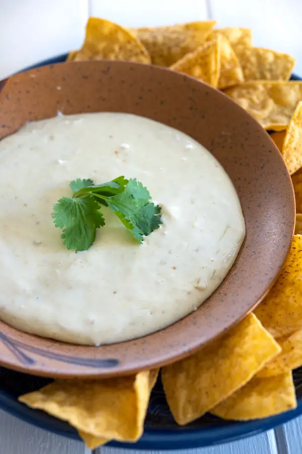 The ultimate Crock Pot Queso dip for your tortilla chips! Real cheese, no velveeta, no meat, vegetarian #superbowl #appetizers