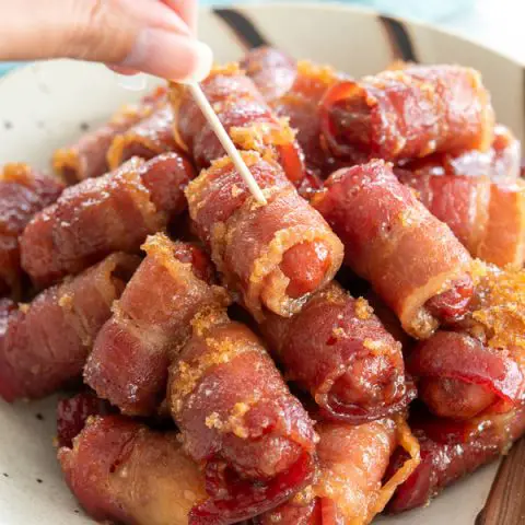 My favorite party appetizers are these crispy bacon wrapped smokies - oven baked with brown sugar and so easy | Little Smokies Wrapped in Bacon #appetizers #appetizerseasy #easyappetizerideas #superbowlparty