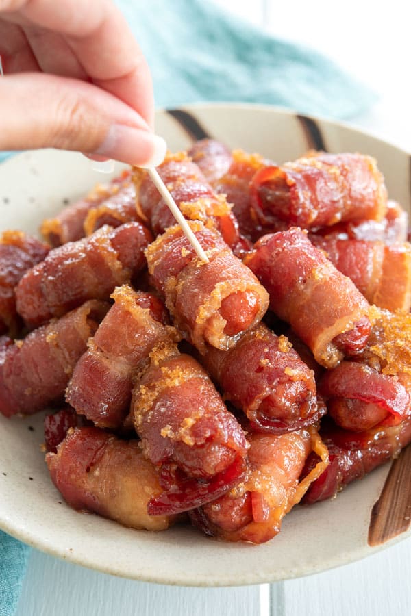 My favorite party appetizers are these crispy bacon wrapped smokies - oven baked with brown sugar and so easy | Little Smokies Wrapped in Bacon #appetizers #appetizerseasy #easyappetizerideas #superbowlparty