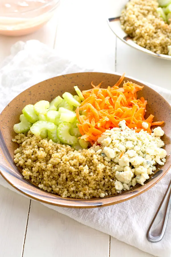 Buffalo Chicken Quinoa Bowl with blue cheese, celery, onion and creamy hot sauce dressing