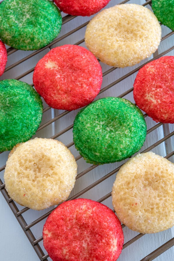 French butter cookies rolled in red and green sugar on cooling rack