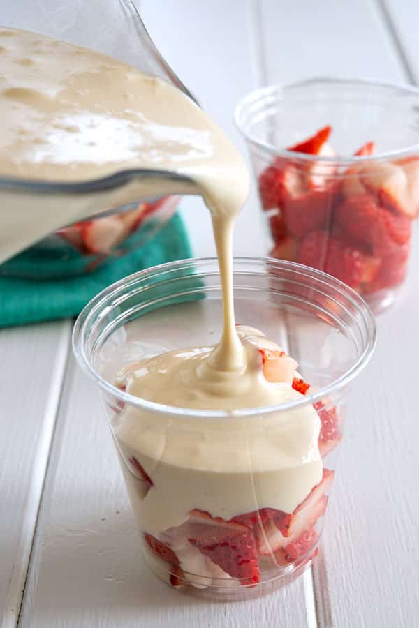 Fresas con Crema - sweet cream being poured over strawberries